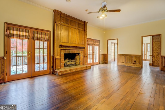 unfurnished sunroom featuring ceiling fan