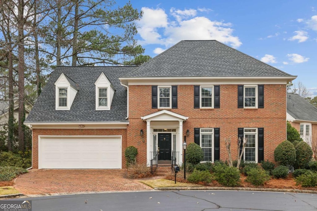 colonial house featuring a garage