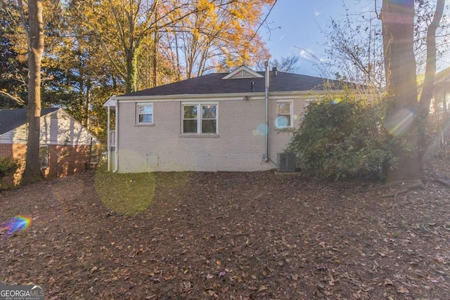 view of side of home featuring central AC