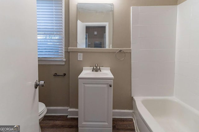 bathroom featuring hardwood / wood-style floors, vanity, and toilet