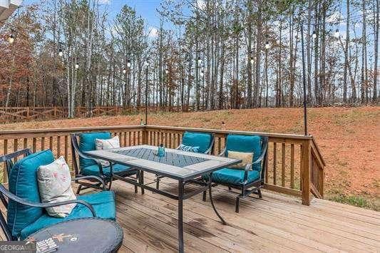 deck featuring outdoor dining area