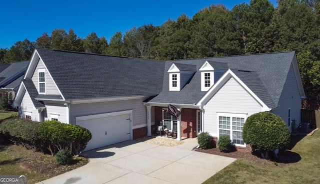 cape cod home with a garage