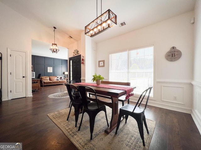 dining area with dark hardwood / wood-style flooring