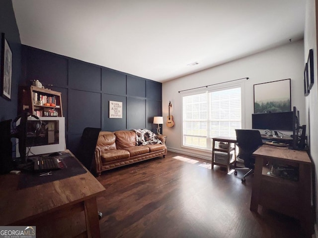 home office with dark hardwood / wood-style floors