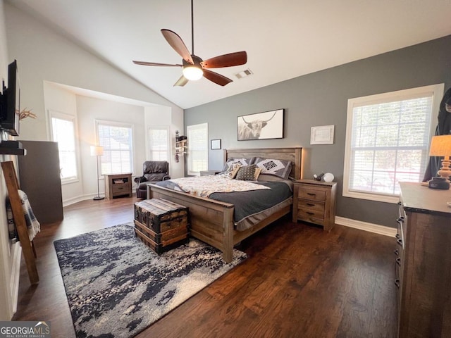 bedroom with multiple windows, ceiling fan, dark hardwood / wood-style flooring, and lofted ceiling