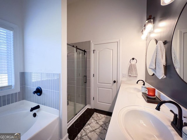 bathroom featuring tile patterned floors, vanity, a healthy amount of sunlight, and shower with separate bathtub