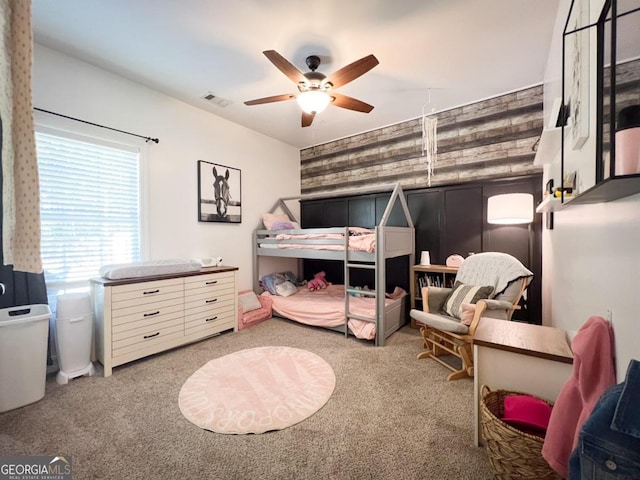 bedroom with light carpet and ceiling fan