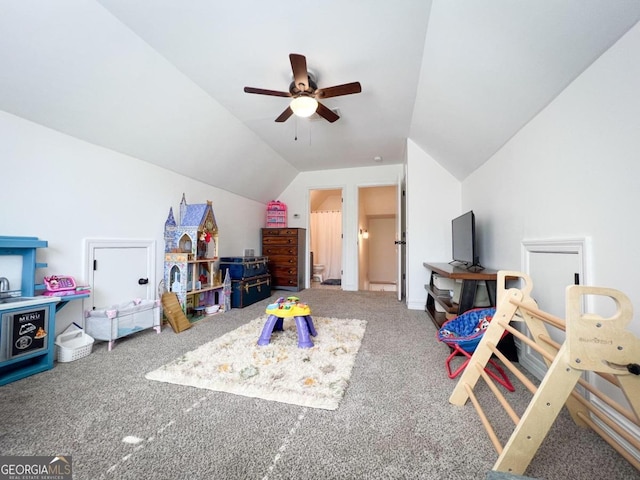 recreation room featuring carpet, vaulted ceiling, and ceiling fan