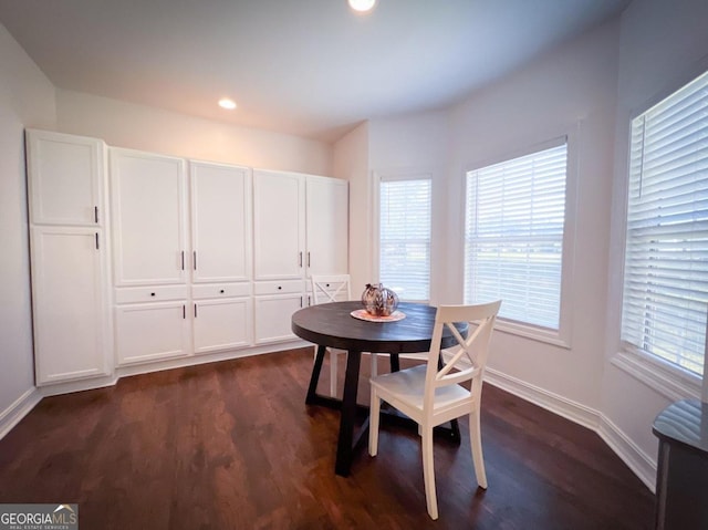 dining space featuring dark hardwood / wood-style floors