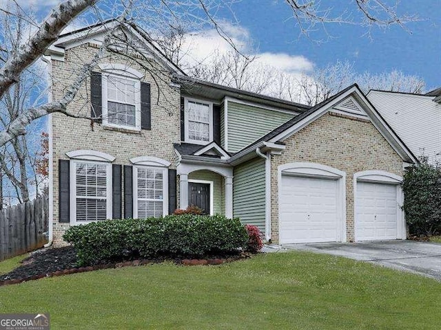 view of front of property with a front lawn and a garage