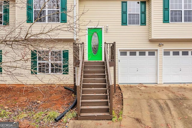 view of exterior entry featuring a garage