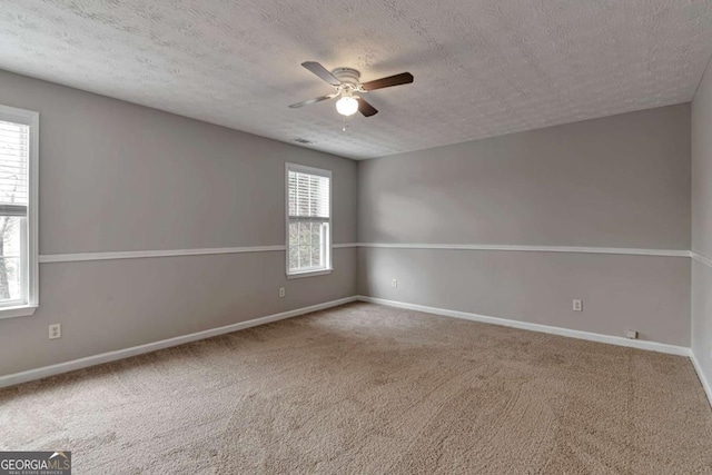 spare room with a healthy amount of sunlight and a textured ceiling