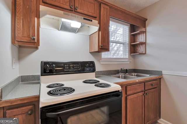 kitchen with a textured ceiling, sink, and white electric stove