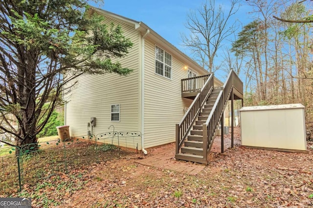 view of home's exterior featuring a wooden deck