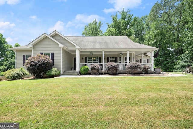 view of front of home with a porch and a front yard