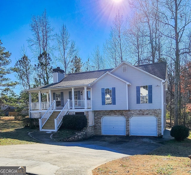 view of front of house featuring a porch and a garage