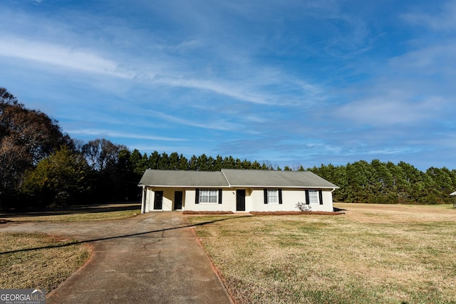 ranch-style house with a front lawn