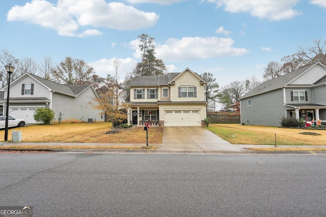 view of front of house with a garage and a front yard