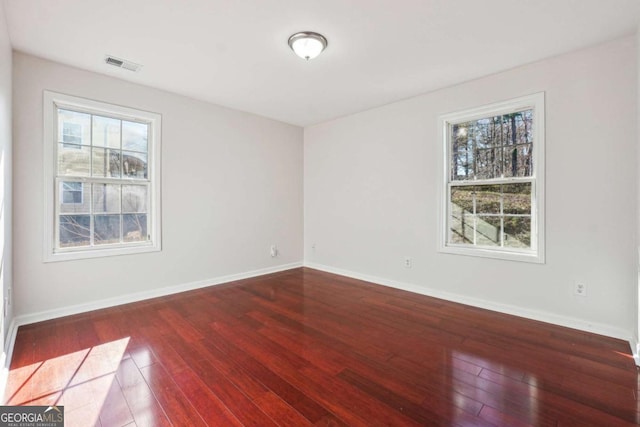 empty room featuring hardwood / wood-style flooring