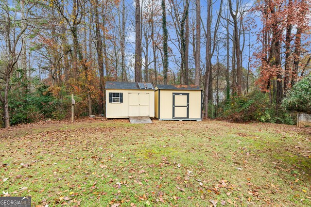 view of outdoor structure featuring a lawn