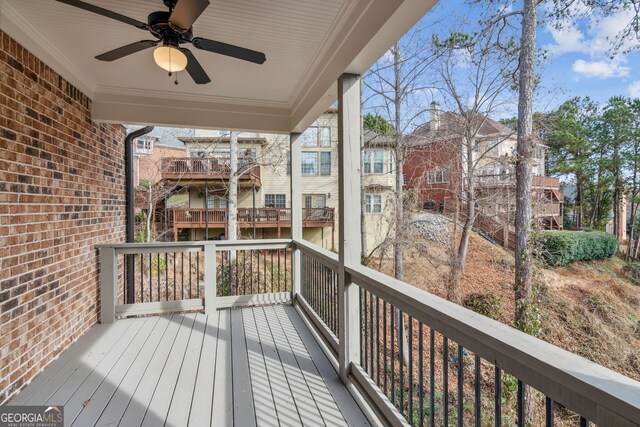 unfurnished living room with ceiling fan, crown molding, and light hardwood / wood-style floors