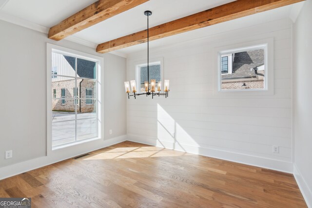 unfurnished bedroom featuring crown molding, ceiling fan, hardwood / wood-style flooring, connected bathroom, and beamed ceiling