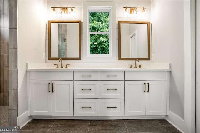 bathroom with tile patterned floors and vanity