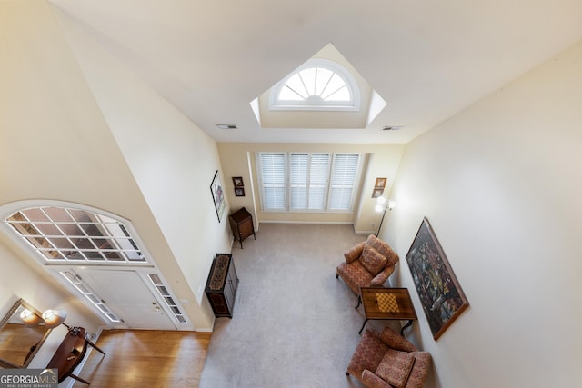 living area with light colored carpet