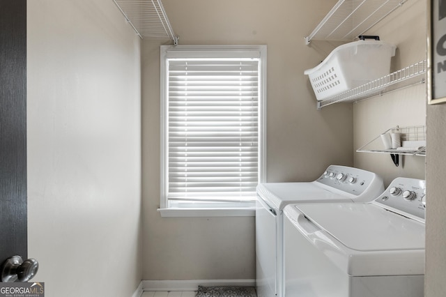 laundry room with washing machine and clothes dryer