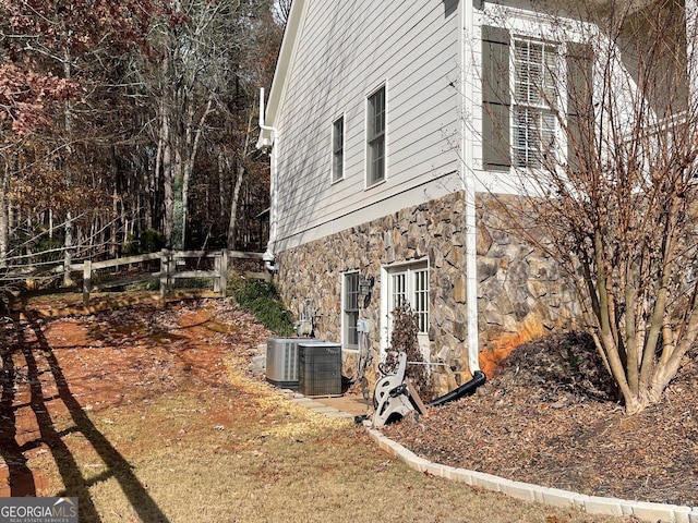 view of property exterior featuring central air condition unit