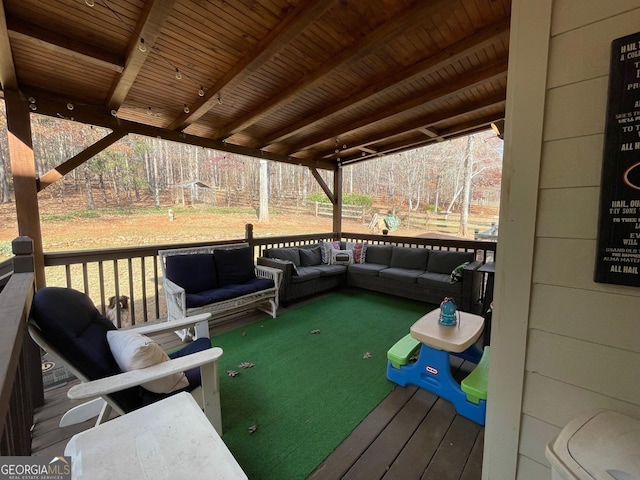 wooden deck featuring outdoor lounge area