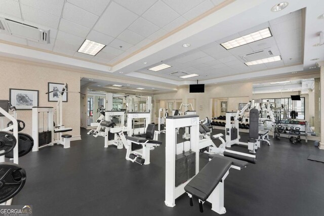 workout area featuring a drop ceiling