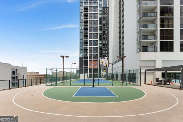 view of basketball court with tennis court