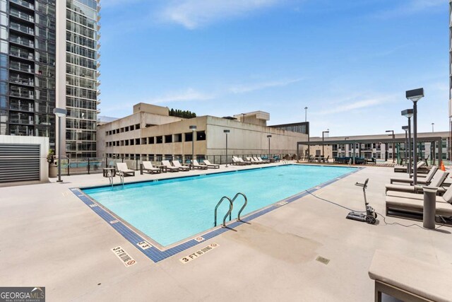 view of pool featuring a patio