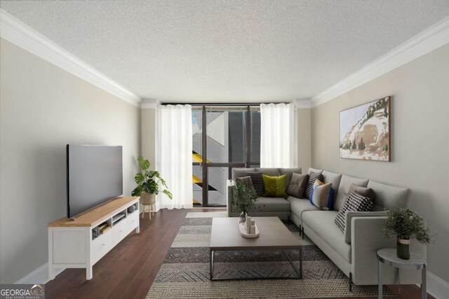 living room with a textured ceiling, dark hardwood / wood-style floors, floor to ceiling windows, and crown molding