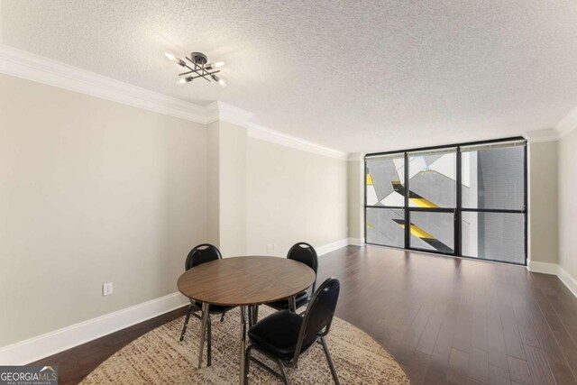 dining area with floor to ceiling windows, ornamental molding, a textured ceiling, and dark wood-type flooring