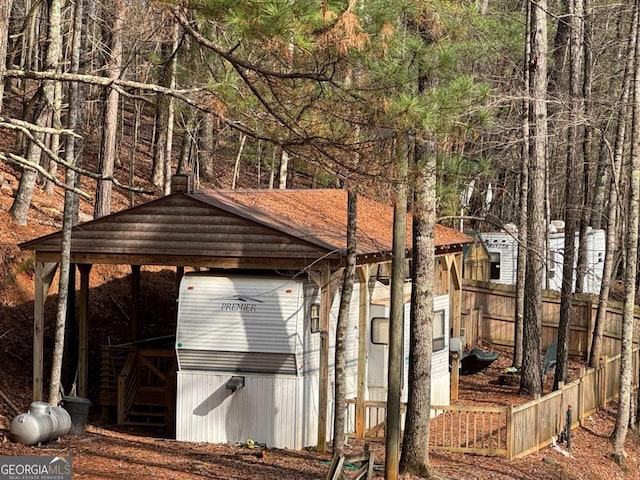 view of outbuilding featuring a carport