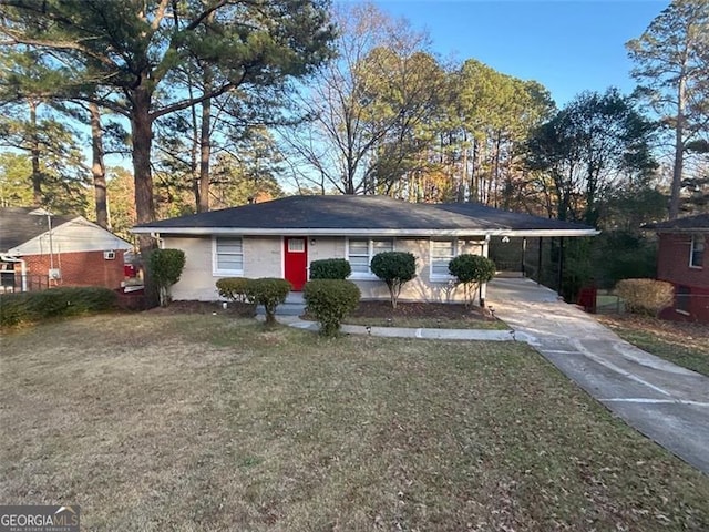 ranch-style house featuring a front lawn and a carport