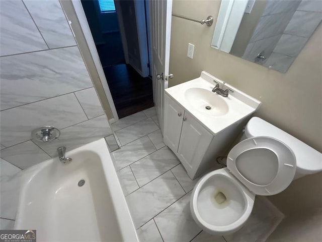 bathroom with vanity and toilet