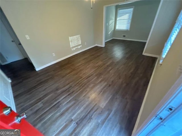 interior space with dark hardwood / wood-style flooring