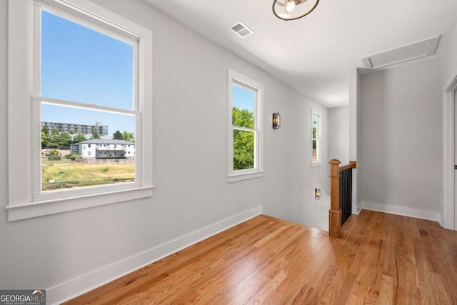 spare room featuring light hardwood / wood-style flooring