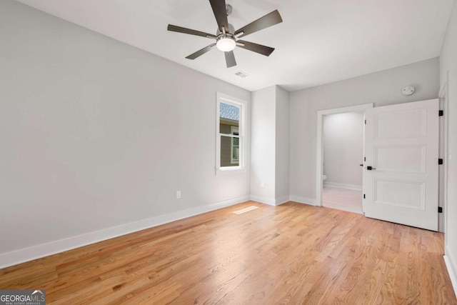 spare room with ceiling fan and light hardwood / wood-style floors