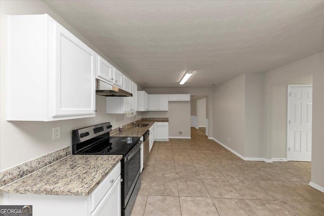 kitchen with sink, a textured ceiling, appliances with stainless steel finishes, light stone counters, and white cabinetry