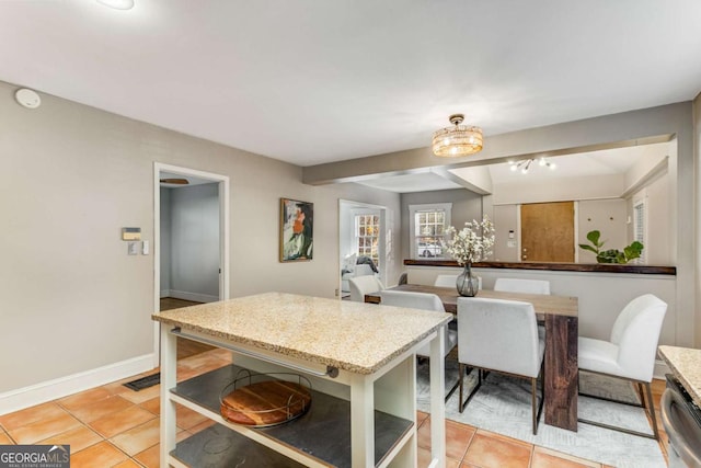 kitchen featuring dishwasher and light tile patterned floors