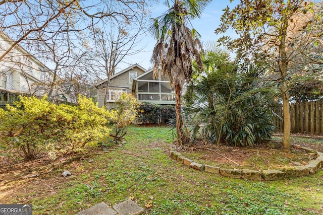 view of yard with a sunroom