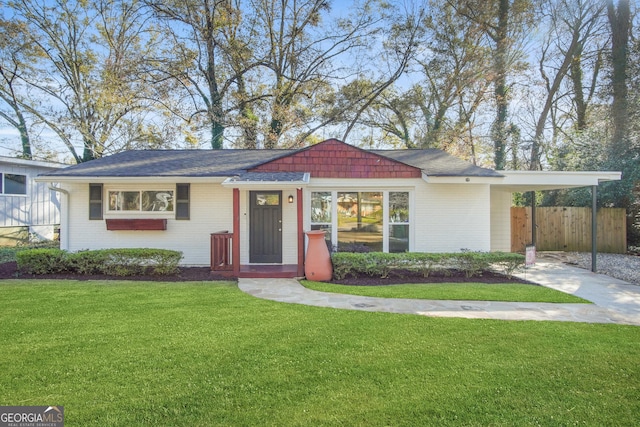 ranch-style house with a carport and a front yard