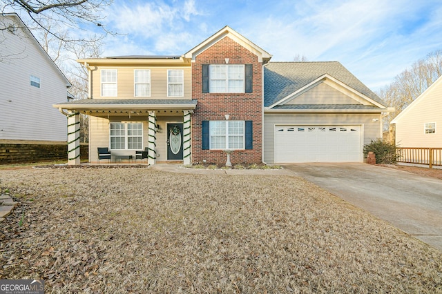 view of front of house with a porch and a garage