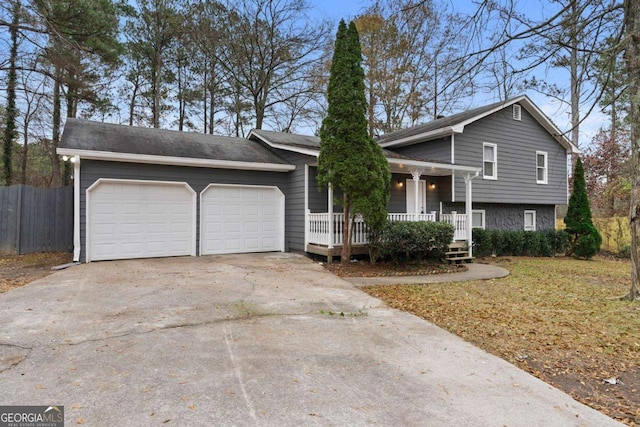 split level home with a porch and a garage