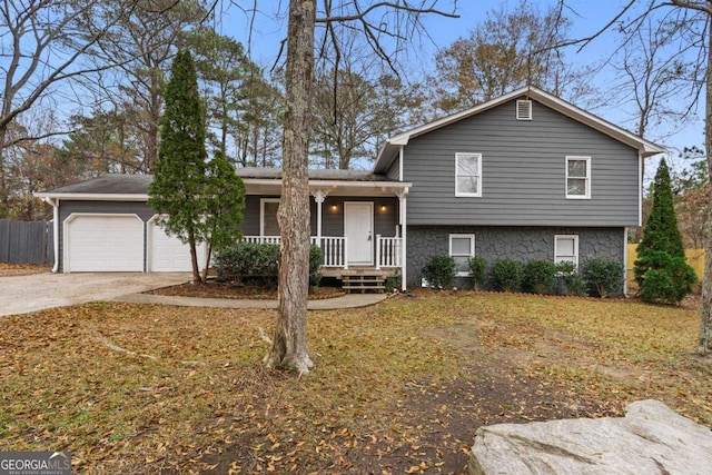 view of front of house with a porch and a garage