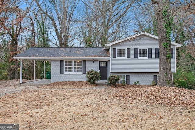 split level home featuring a carport